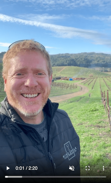 Jason Haas close up with vineyard backdrop