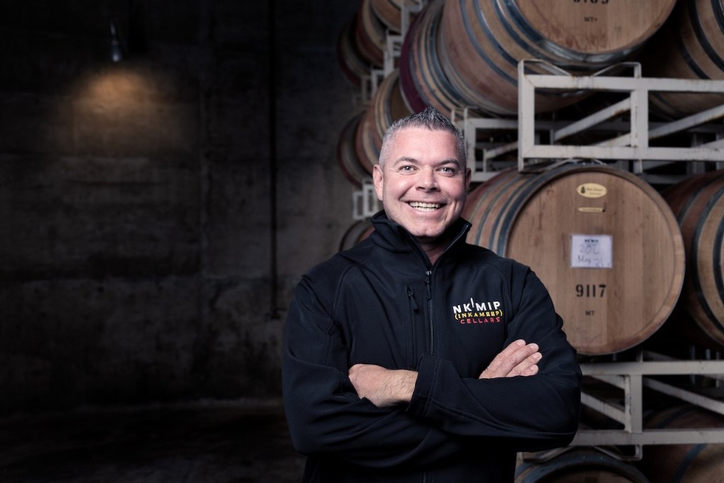 photo of winemaker Justin Hall in barrel room