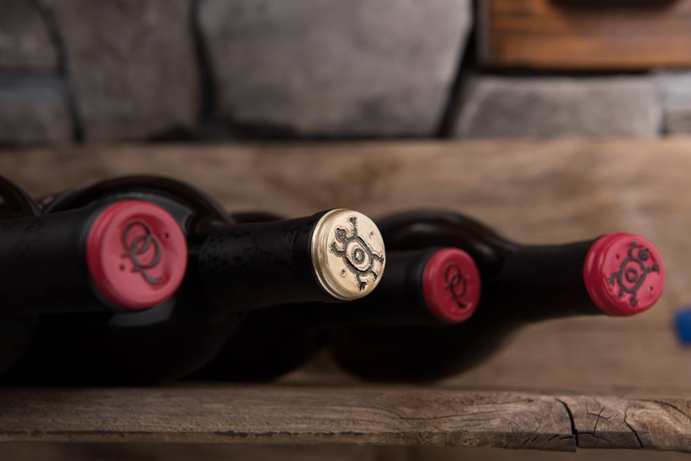 four bottles with screw caps